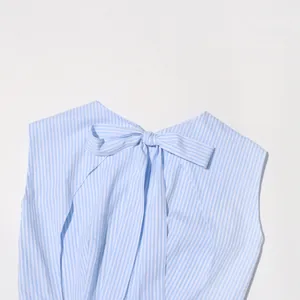 Close-up detail of a French style vintage striped dress showing a decorative bow-tie back.