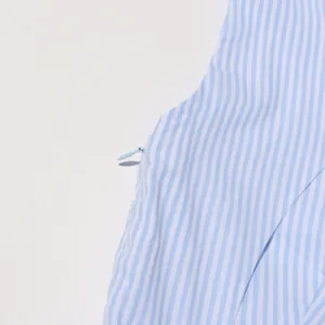 Close-up detail of an invisible zipper on a blue and white striped vintage French dress