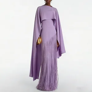 Macro view of lavender evening dress detail with elegant cape and fringe tassel skirt.
