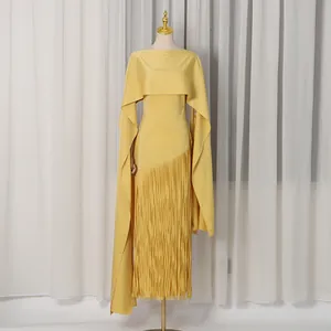 Elegant yellow maxi dress with unique cape overlay and long moving fringe tassels