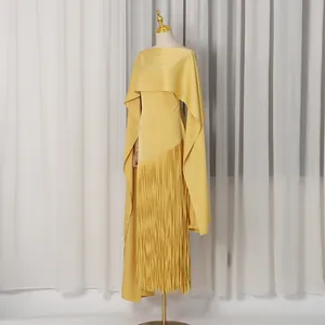 Elegant yellow maxi dress featuring a cape design and a long fringe hem displayed on mannequin