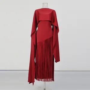 Elegant red evening dress featuring a unique cape design and long fringe hem details.