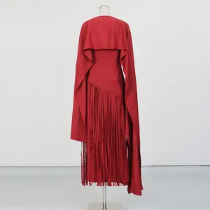 Elegant red dress featuring cape shoulder design and long asymmetric fringe hem details