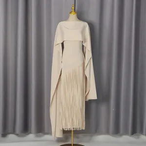 Elegant beige long dress with stylish cape design and detailed fringe hem