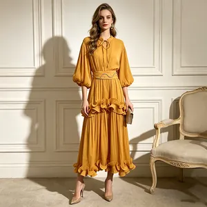 Full view of elegant yellow French style midi dress featuring puff sleeves and ruffled hem