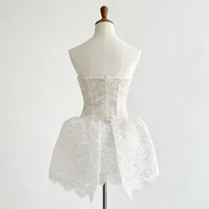 Detailed back view of a French-style white lace embroidered strapless mini dress