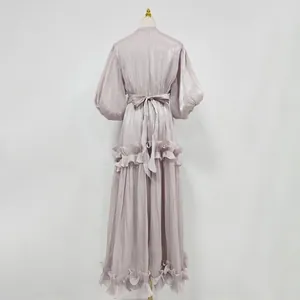 Back view of elegant lavender maxi dress with puff sleeves and ruffled hem