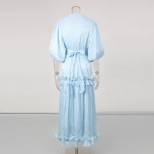 Detailed back view of an elegant light blue puff sleeve maxi dress with ruffles
