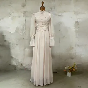 Vintage French style long dress with high ruffle neck and puff sleeves on mannequin stand