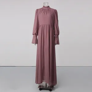 Detailed view of an elegant French court style dusty pink maxi dress with high ruffled neck