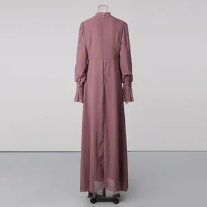 Detailed back view of an elegant dusty rose French style maxi dress with ruffled high collar.