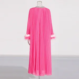 Fuchsia pleated long maxi dress with rhinestone collar and ostrich feather cuffs detail.