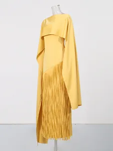 Elegant yellow evening dress featuring long cape sleeves and asymmetric fringe hemline