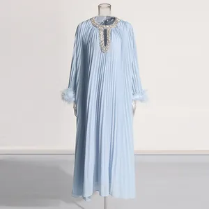 Elegant pleated sky blue maxi dress with rhinestone neckline and feather cuffs detail
