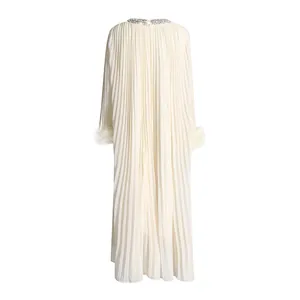 Back view of an elegant pleated cream maxi dress with rhinestone collar and feather cuffs