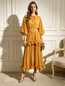 Elegant French style mustard yellow maxi dress with puff sleeves and ruffle details