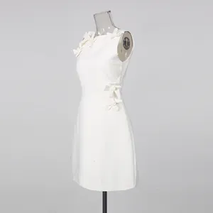 Elegant white sleeveless dress detail featuring stylish 3D floral patches for women