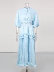 Elegant French style light blue maxi dress with puff sleeves and tiered ruffle hem