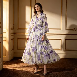 Elegant floral long-sleeved dress with lantern sleeves and belted waist in an upscale room