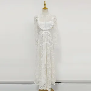 Detail of white water-soluble lace embroidery on French style elegant long sleeve dress