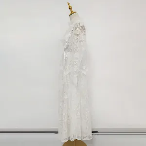 Side detail view of a white French luxury lace dress with exquisite floral embroidery