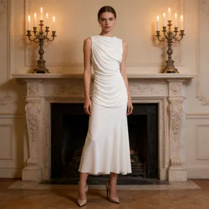 Elegant white sleeveless dress with ruched detailing in a classic interior setting