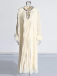 Elegant cream pleated maxi dress with rhinestone neckline and ostrich feather cuffs