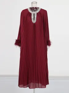 Elegant wine red pleated maxi dress featuring rhinestone neckline and ostrich feather cuffs