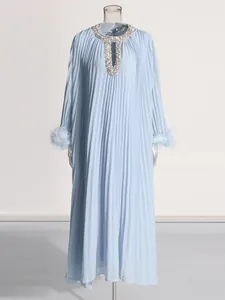 Elegant light blue pleated maxi dress with rhinestone neckline and ostrich feather cuffs