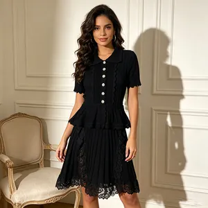 Detailed view of elegant black polo collar dress with button front and lace hem