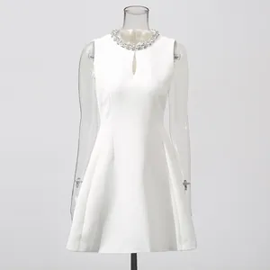 Elegant white sleeveless A-line dress with a sparkling rhinestone collar and front cutout.