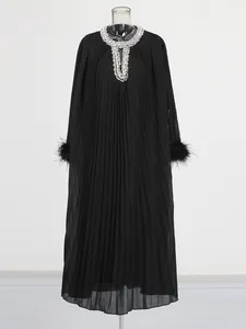 Elegant black pleated maxi dress with rhinestone neckline and ostrich feather cuffs