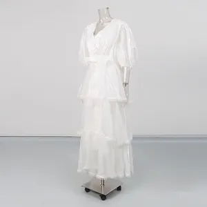Elegant vintage white V-neck dress with puffy sleeves and delicate lace trim detail