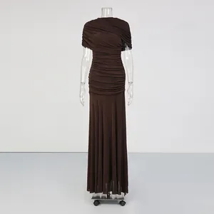 Elegant dark brown ruched sleeveless maxi dress for women in a minimalist studio setting.