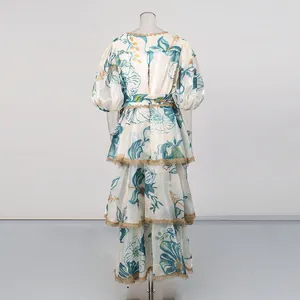 Detailed back view of a vintage floral maxi dress with puff sleeves and lace trim stitching