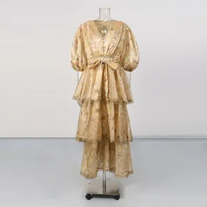 Detailed view of vintage V-neck tiered floral maxi dress with intricate lace trim details