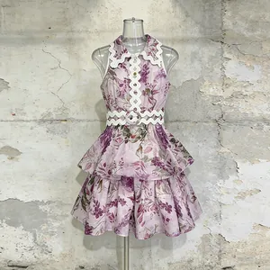 Vintage floral sleeveless dress featuring scalloped ric-rac trim and a matching waist belt