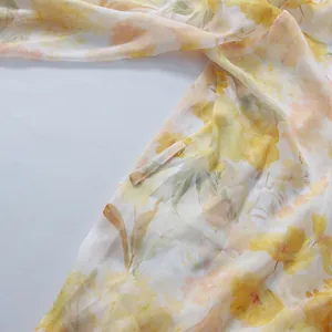 Close-up detail of romantic pastoral floral dress fabric texture and waist loop