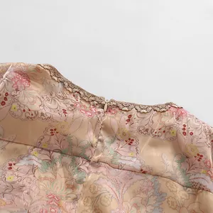 Close-up of vintage floral dress neckline with lace trim and invisible zipper detail