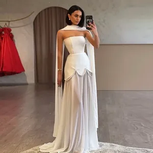 Elegant white strapless evening gown with mesh patchwork and pearl beaded details
