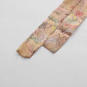 Detailed close-up of high-quality vintage floral print sash belt for retro style dresses