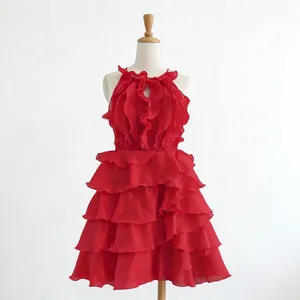 Detailed view of red sleeveless tiered ruffle dress with high waist design