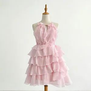 Close-up of a stylish pink sleeveless dress featuring tiered ruffles and high waist design