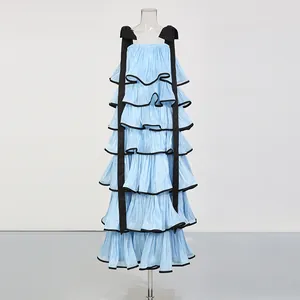 Elegant blue tiered ruffle maxi dress with black wide straps and pleated fabric texture