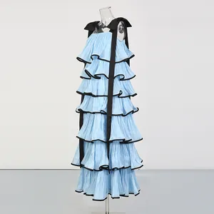 Detailed view of light blue tiered ruffle maxi dress featuring black ribbon shoulder straps
