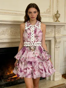 Sweet sleeveless floral mini dress with white wave edge collar and matching waist belt.