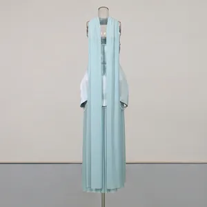 Light blue elegant evening gown featuring sheer drapes and pearl bead details
