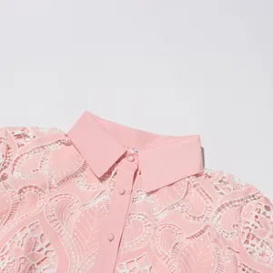 Detail shot of pink heavy embroidery lace dress showing collar and button details