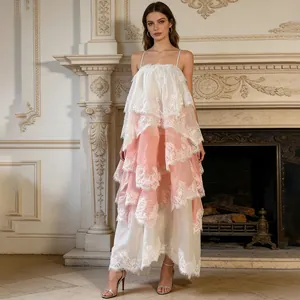 Elegant tiered lace maxi dress with spaghetti straps for a romantic resort spring look.