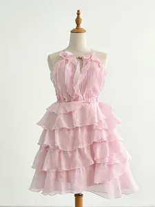 Elegant pink ruffled sleeveless mini dress featuring high waist and feminine halter neck design